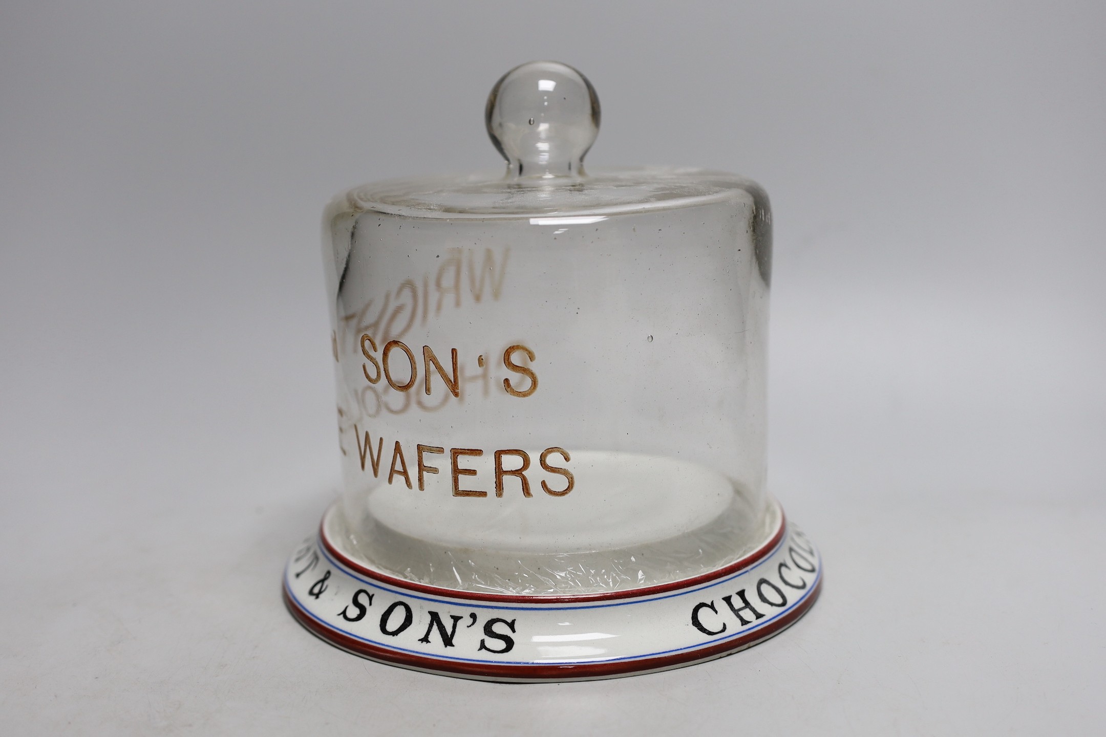 A Wright & Son’s Wafers display pottery stand with glass dome. 19cm tall overall
